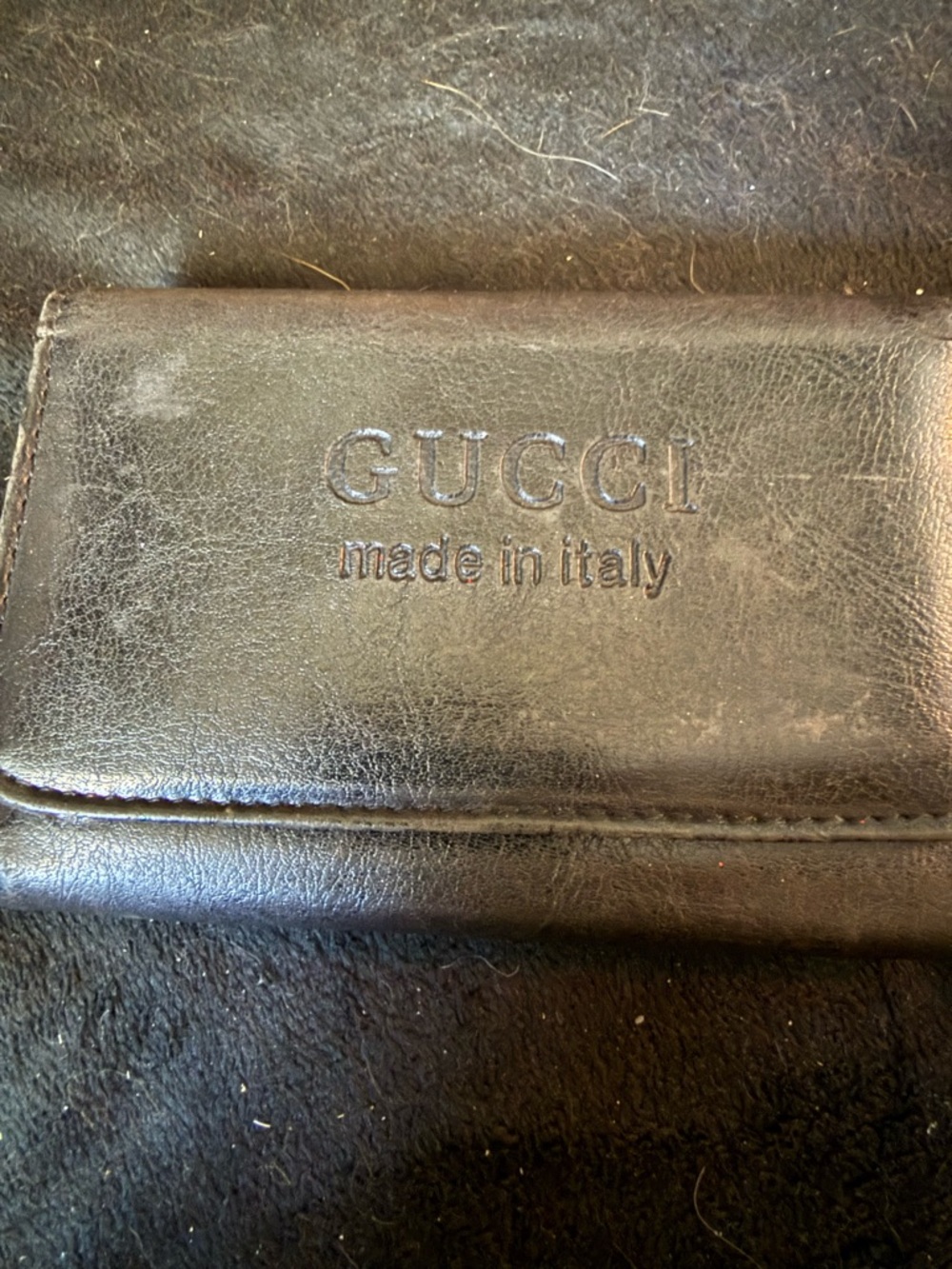 Gucci Black Leather Embossed Logo Wallet
